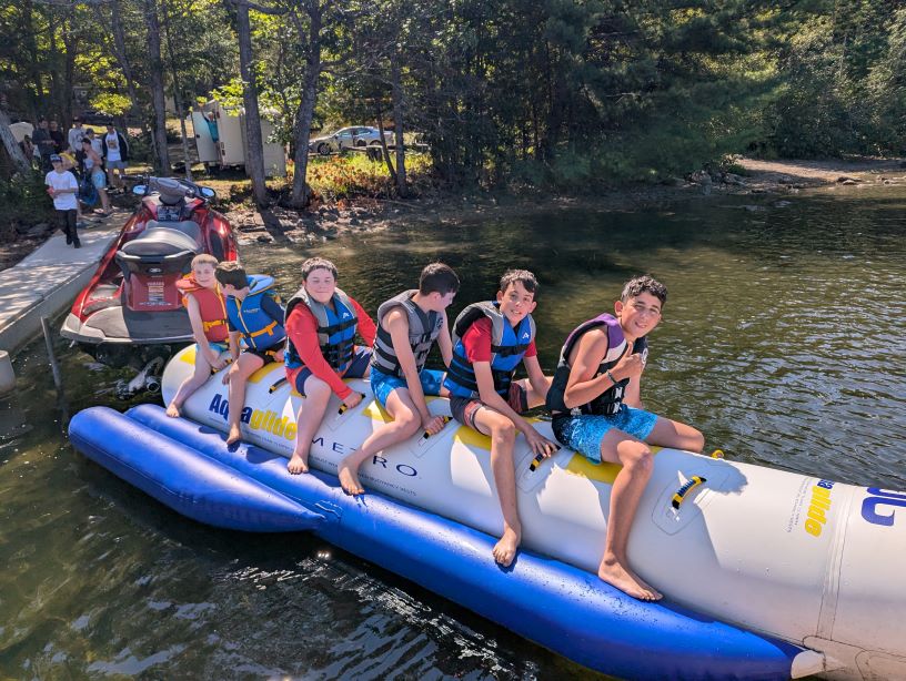 camp chai boy on a banana boat